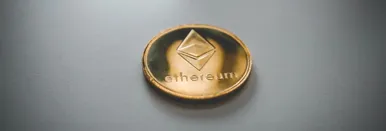 A golden coin that says 'ethereum'.